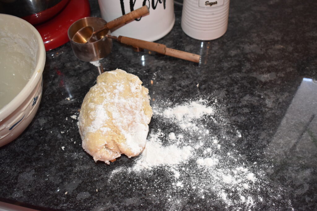 dough turned out on to the counter with flour dusting