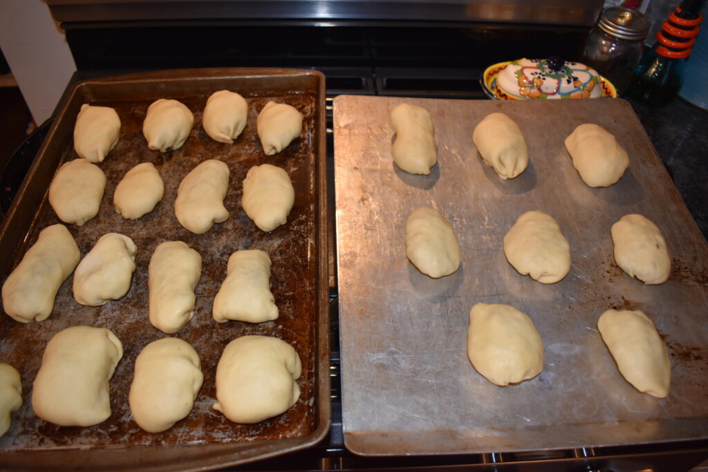 Rolls on a cookie sheet ready to bake