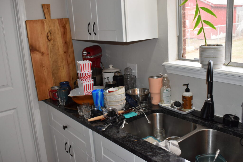 Kitchen counter with dirty dishes waiting to be washed.