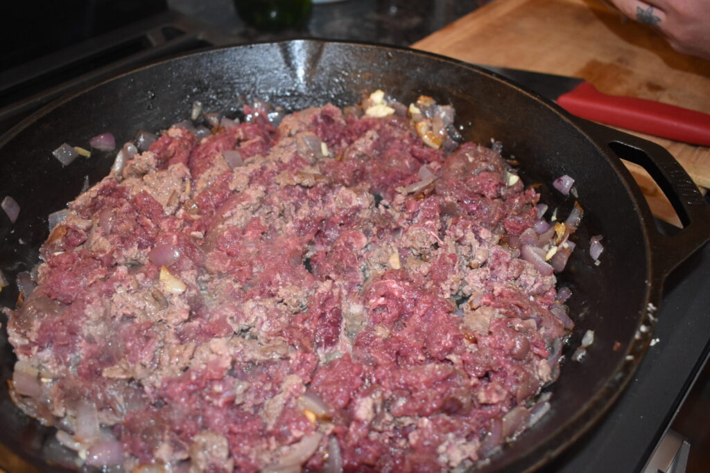 deer meat browning in a skillet