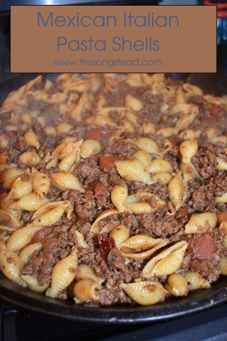 Pan of hot pasta with meat and tomato sauce with text overlay