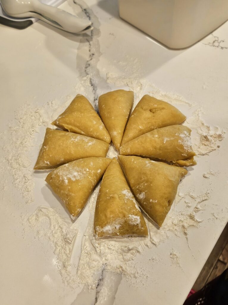 pasta dough cut up on the counter in a dusting of flour